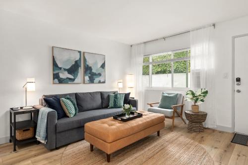 a living room with a gray couch and a chair at Central Apartment in a Hip Walkable Neighborhood NRP23-01143 in Long Beach