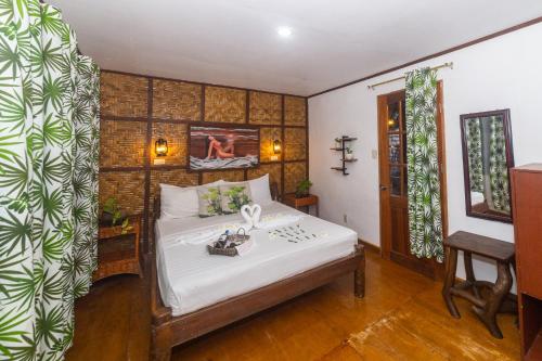 a bedroom with a bed in a room at Natura Vista in Panglao