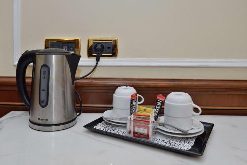 a coffee maker on a tray on a counter at Hotel Hiberia in Rome