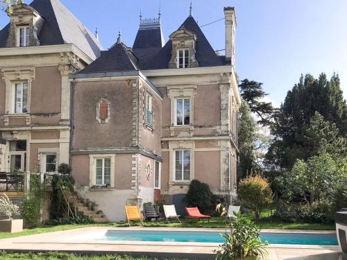 a large house with a pool in front of it at Maison de maître avec piscine et jardin - cœur des Coteaux du Layon, proche Angers et Saumur - FR-1-622-55 in Faye-dʼAnjou