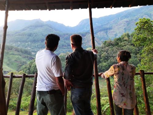 a group of three people standing on top of a mountain at Bambara Ella Agro Resort & Camping in Haputale