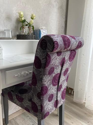 a chair sitting in front of a desk at Hotel Haus Loewe in Frechen