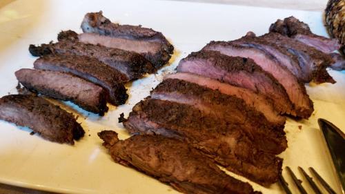 a plate with several pieces of meat on it at Ella Nine Peaks in Ella