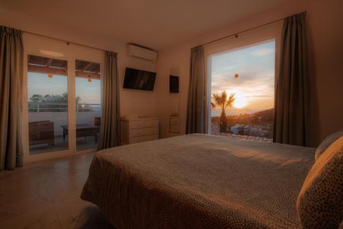 Una cama o camas en una habitación de Villa Can Joan I - Fantastic Sunset Views and Family Friendly -