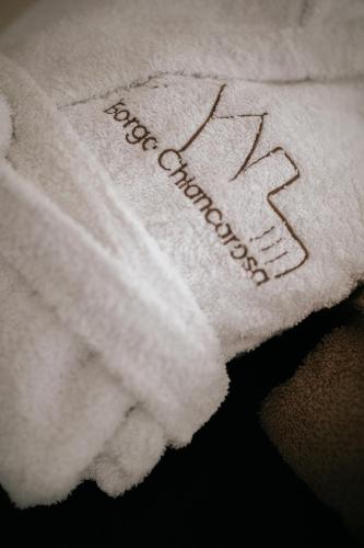 a white towel with the word new pharmacy on it at Borgo Chiancarosa in Putignano