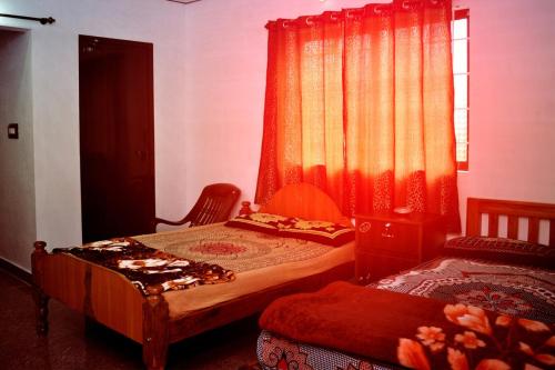 A bed or beds in a room at REST POINT HOMESTAY