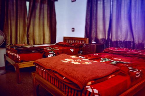 Postel nebo postele na pokoji v ubytování REST POINT HOMESTAY
