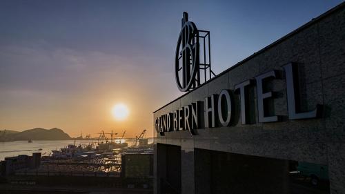 a sign for a hotel on the side of a building at Yeongdo Grandbern Hotel in Busan