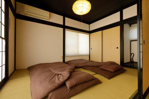 a bedroom with a large bed in a room at Isumi Resonal Ohara in Isumi