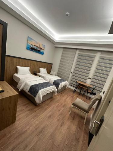 Ένα ή περισσότερα κρεβάτια σε δωμάτιο στο Akel Guest House