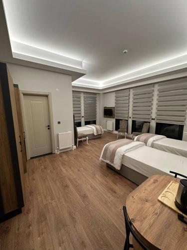 Ένα ή περισσότερα κρεβάτια σε δωμάτιο στο Akel Guest House