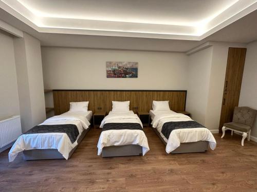 Ένα ή περισσότερα κρεβάτια σε δωμάτιο στο Akel Guest House