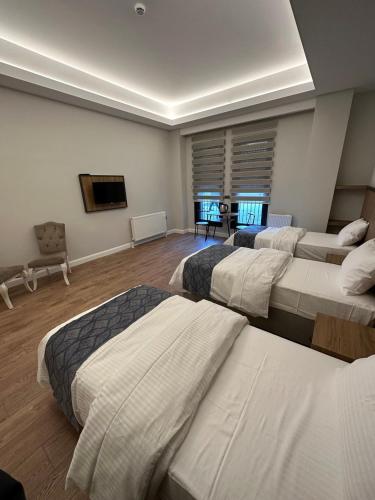 Ένα ή περισσότερα κρεβάτια σε δωμάτιο στο Akel Guest House