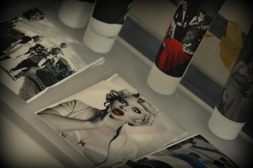 a picture of a woman with red lipstick and some pictures at Hotel Italia in Siena