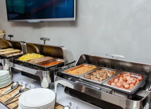 a buffet line with many different types of food at Bay Ali in Tölöykön