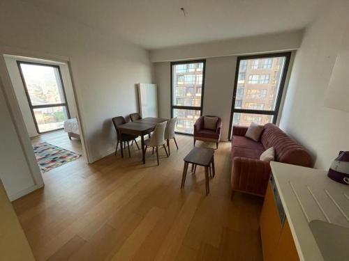 a living room with a couch and a table at Fully equipped house within a serviced compound in Istanbul