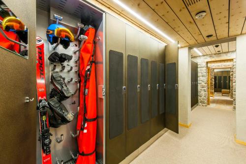 a room with a bunch of skis on the wall at Cresta Palace Celerina St Moritz Ski In and Ski Out in Celerina
