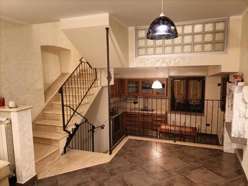 a staircase in a house with a stair case at Il palazzetto "fori porta" in Vitorchiano