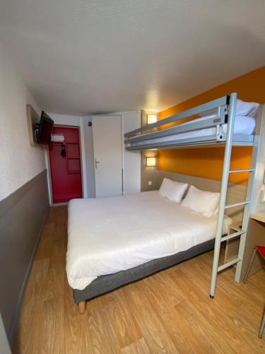 a bedroom with a bunk bed with a ladder at Première Classe Nantes Sud - Rezé Aéroport in Rezé