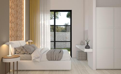 a living room with a white couch and a window at LUZ BLANCA in Agios Leon