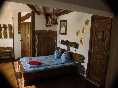 a bedroom with a bed and an open door at Predeal Club in Predeal