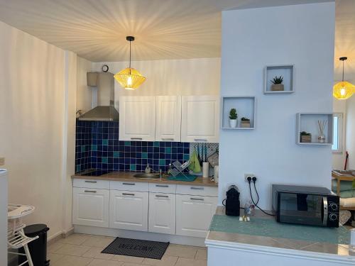 Kuchyň nebo kuchyňský kout v ubytování Appartement au calme - Proche centre ville