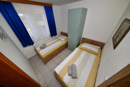 Postel nebo postele na pokoji v ubytování Apartment Ivo Kaurinovic