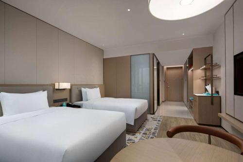 Ένα ή περισσότερα κρεβάτια σε δωμάτιο στο Wyndham Changzhou Xinbei