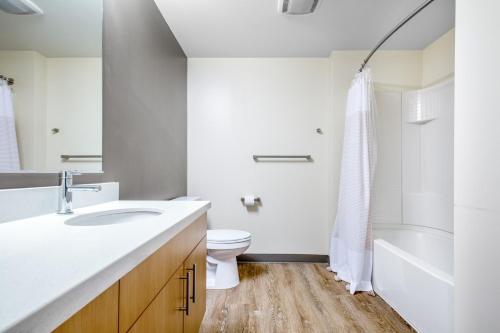 a bathroom with a sink and a toilet and a shower at Downtown Bellevue 1BR w Lounge Gyms nr shops SEA-125 in Bellevue