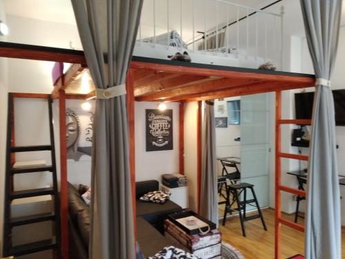 a loft bed in a tiny house at Downtown Dream in Zagreb
