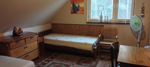 Posteľ alebo postele v izbe v ubytovaní Dom nad łąkami