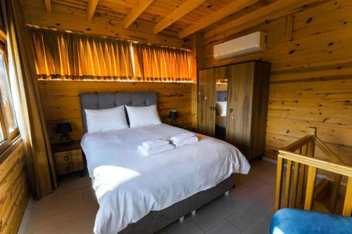 Postel nebo postele na pokoji v ubytování Sarı Köşk Hotel