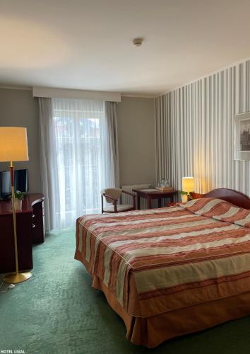 Postel nebo postele na pokoji v ubytování Hotel Lival