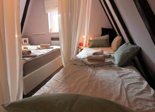 a bedroom with two beds in a room at CASA MONTE in Lič