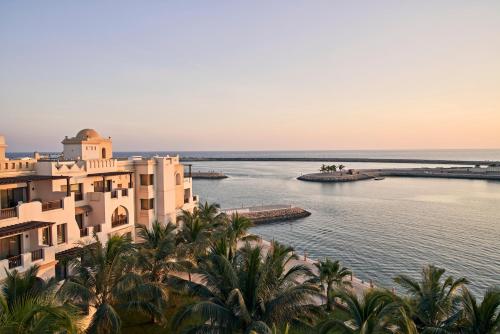 a view of the ocean from a resort at Fanar Hotel & Residences in Salalah