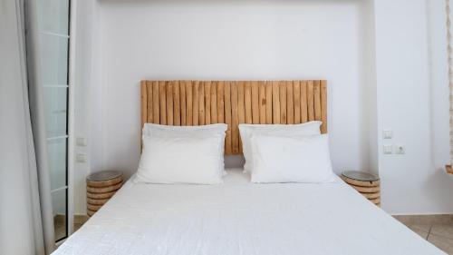 a bedroom with a bed with two white pillows at Sea Bliss Adults Only in Parga