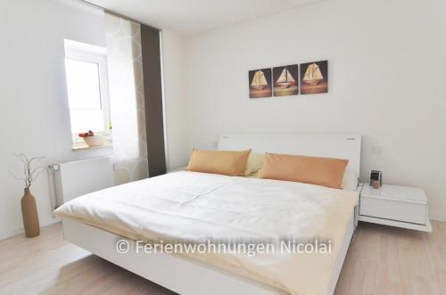 Postel nebo postele na pokoji v ubytování Panorama Schönberger-Strand Appartment 27