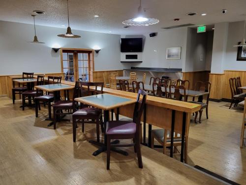 a large dining room with tables and chairs at Quality Inn & Suites Canon City in Canon City