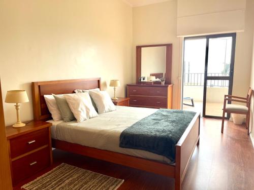 Katil atau katil-katil dalam bilik di Beach Front House