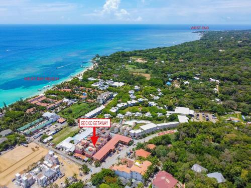 an aerial view of a resort near the ocean at Gecko Getaway condo in Roatan