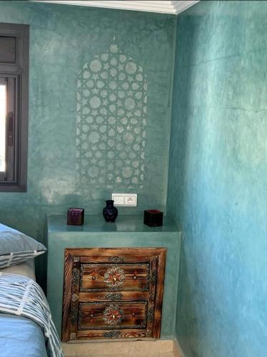 Кровать или кровати в номере Les jardins berbères d'Agadir