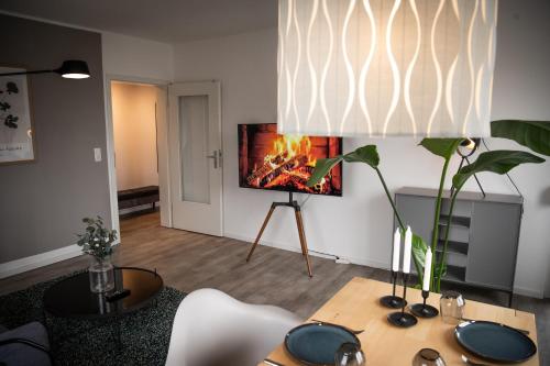 Телевизор и/или развлекательный центр в Apartment Strauss #DREI 3 Zi BS-Nordstadt