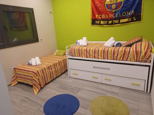 a bedroom with two twin beds and a mural on the wall at Catalunya Casas Modern Marvel,15 min to Costa Brava beaches! in Sils