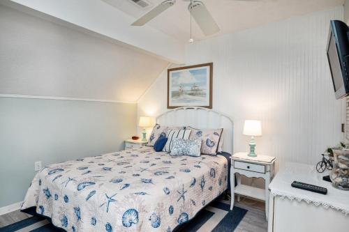 a bedroom with a bed and a tv in it at A Dream Come True in Caswell Beach