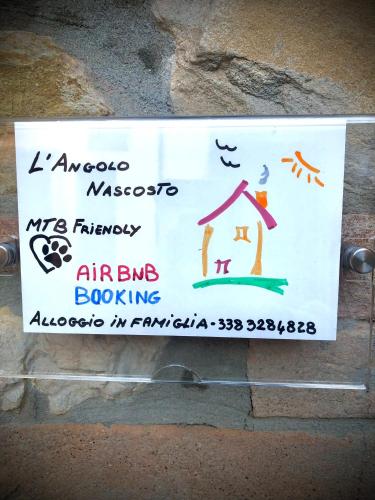 a sign on a wall with a sign for an airbu bombing at L'angolo nascosto in Rivergaro