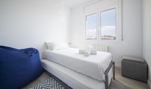 Postel nebo postele na pokoji v ubytování R143 Beachfront Apartment Dorianne