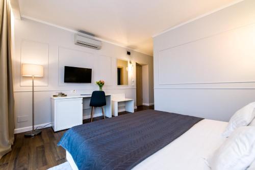 Postel nebo postele na pokoji v ubytování Hotel Ramina