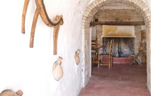 an archway in a room with a fireplace at 2 Bedroom Cozy Home In Baza in Baza