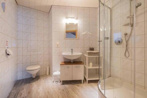 a bathroom with a shower and a sink and a toilet at Haus Simone in Neustift im Stubaital