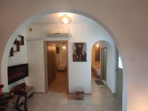an archway leading to a room with a living room at Platanaki Mountain Home 